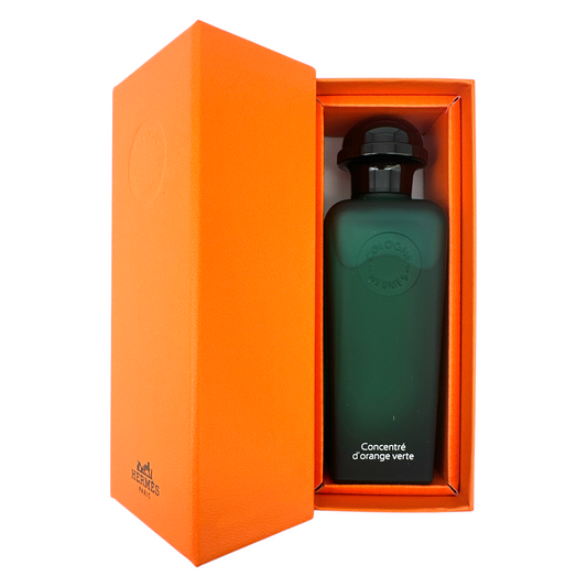 Hermes Concentre D'Orange Verte Eau De Toilette 100ml bottle, featuring a sleek green glass design with a black cap, representing a fresh citrus fragrance for men and women, available at Zakura Global.